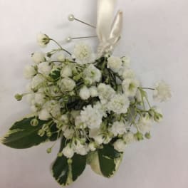 White floral boutonniere with ribbon and pearl pins