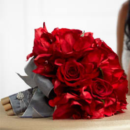 Bouquet of red roses wrapped in gray ribbon