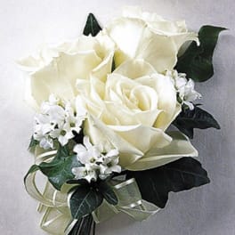 Small white rose bouquet with tiny white blossoms and a sheer ribbon bow