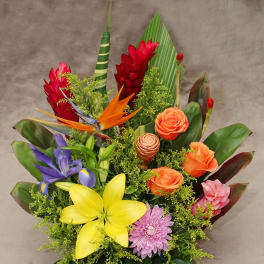 Tropical bouquet with roses, lilies, iris, and bird of paradise