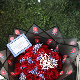 Bouquet of red roses with blue filler and Spider-Man wrapping