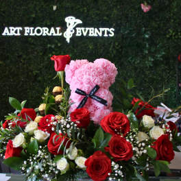Heart-shaped pink rose teddy with red and white roses in a wooden box