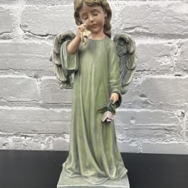 Angel figurine holding a small flower and a cloth