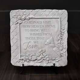 Decorative memorial plaque with a cardinal and floral relief