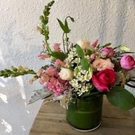 Pink and white mixed bouquet in a green vase