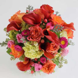 Bouquet of red calla lilies and mixed pink-orange flowers