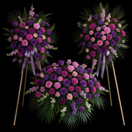 Three purple and pink floral standing sprays on easels