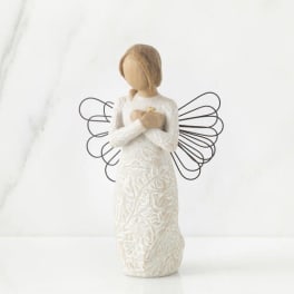 White angel figurine with wire wings and a long textured dress