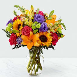 Colorful mixed bouquet in a clear glass vase
