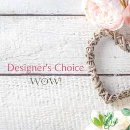 Blush and white flowers with a woven heart on white wooden boards and text reading Designer's Choice WOW.