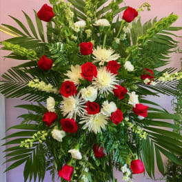 Tall floral spray with red roses and white spider mums
