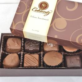 Box of assorted chocolates in a brown and cream package