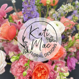 Mixed bouquet of pink, peach, and purple flowers with roses and delphinium, with a circular florist logo overlay.