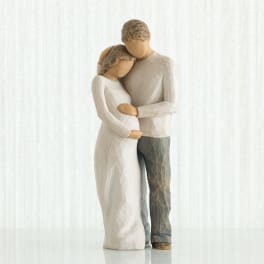 Wooden figurine of a couple embracing