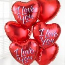 Cluster of red heart-shaped balloons with "I Love You" text