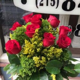 Bouquet of red roses with yellow filler flowers