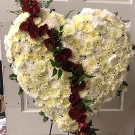Heart-shaped floral spray with white chrysanthemums and red roses