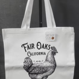 White tote bag with a chicken illustration and Fair Oaks California text