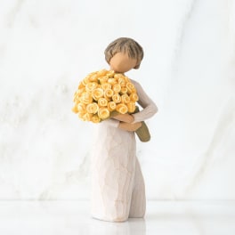 Figurine of a girl holding a bouquet of yellow roses