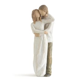 Wooden figurine of a couple embracing