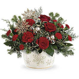 Red roses and carnations in a white snowflake vase