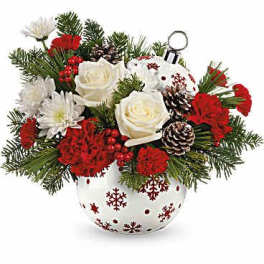 Christmas bouquet in a snowflake-decorated vase with red and white flowers
