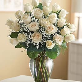 Bouquet of white roses in a clear glass vase