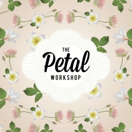 Floral logo with pink blossoms and white-yellow flowers around the text The Petal Workshop