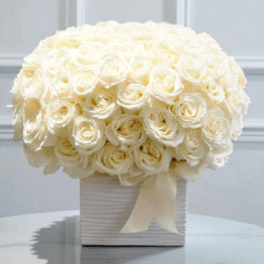 White rose bouquet in a ribbed square box with a ribbon