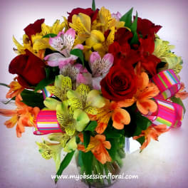 Bouquet of red roses and colorful alstroemeria with striped ribbon