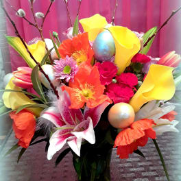 Colorful bouquet with calla lilies, lilies, and poppy-like blooms