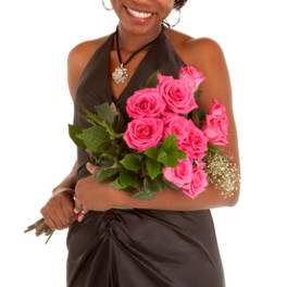Woman holding a bouquet of bright pink roses
