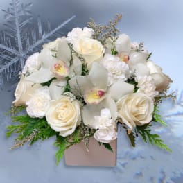 White rose and orchid arrangement in a square box