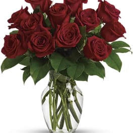 Bouquet of red roses in a clear glass vase
