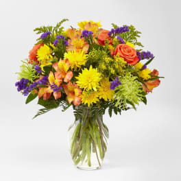 Colorful mixed bouquet in a clear glass vase