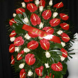 Standing floral spray with red anthuriums and white roses