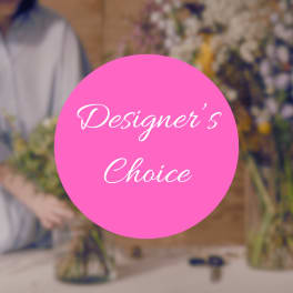 Pink circle reading "Designer’s Choice" over blurred floral arrangements