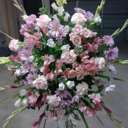Large pastel floral spray with pink, white, and lavender blooms