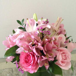 Pink mixed flower bouquet in a glass vase