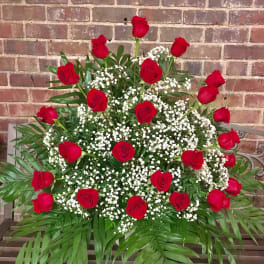 Large arrangement of red roses and white baby's breath