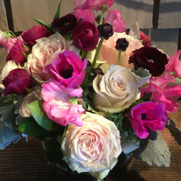 Bouquet of pink, white, and burgundy flowers in a vase
