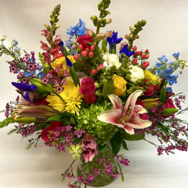 Colorful mixed bouquet in a clear glass vase