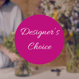 Designer’s Choice text over a blurred florist workspace