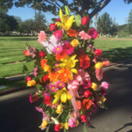 Large colorful floral standing arrangement outdoors