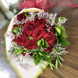 Bouquet of red roses with small lavender filler flowers