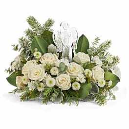 White rose arrangement with an angel figurine