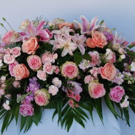 Large pink and peach floral spray with lilies and roses