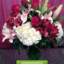 Bouquet of red roses, white lilies, and white hydrangea