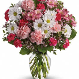 Pink and white mixed bouquet in a clear glass vase