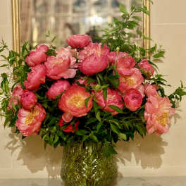 Pink peony bouquet in a glass vase
